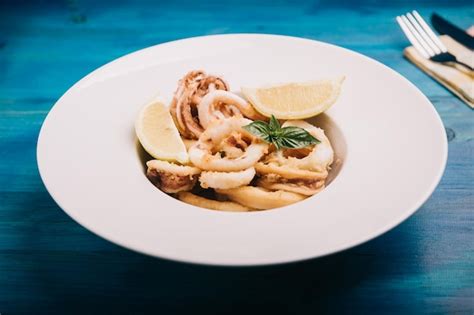 Premium Photo | Deep fried calamari rings on a dish