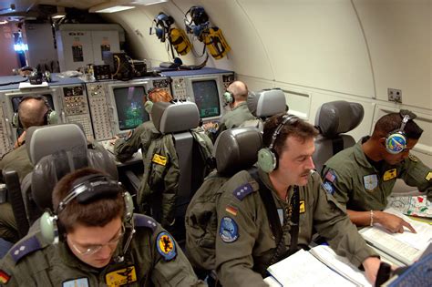 An airman shows the interior of the E-3 Sentry, the sophisticated radar aircraft operated by NATO