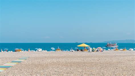 Premium Photo | Batumi georgia 30 august 2022 people relax on the beach in batumi tourism