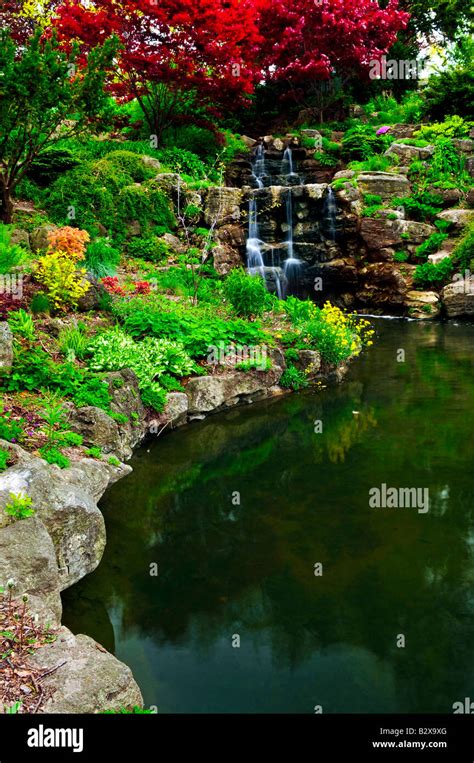 Cascading waterfall and pond in japanese garden Stock Photo - Alamy