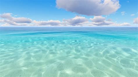 the water is very clear and blue with some clouds