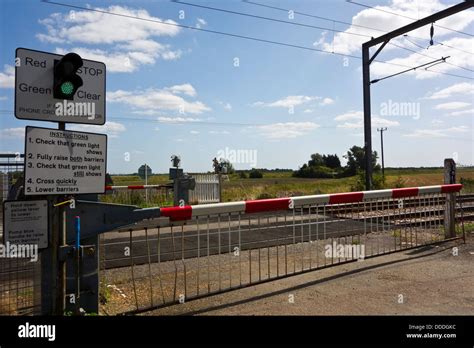 level crossing sign railway Unmanned with train Stock Photo - Alamy