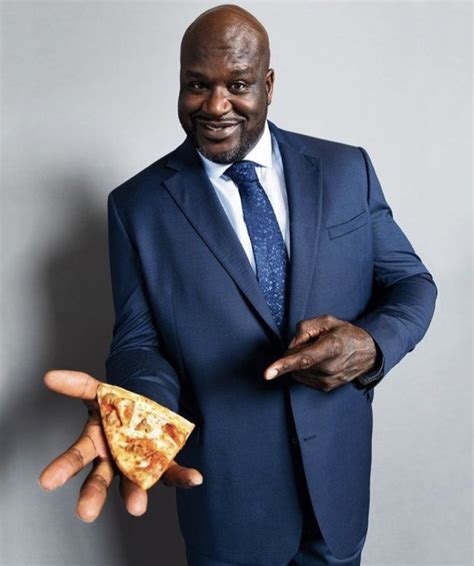 Shaq Holding Things