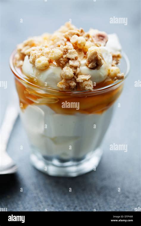 greek yogurt with honey and granola Stock Photo - Alamy