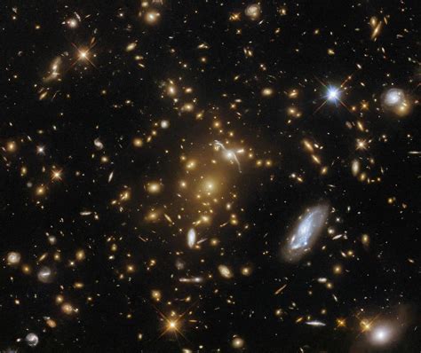 Hubble Captures a Light-Bending Galaxy Cluster