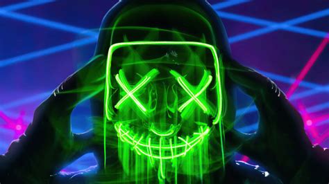 Download A Man With A Green Mask And Neon Lights Wallpaper | Wallpapers.com