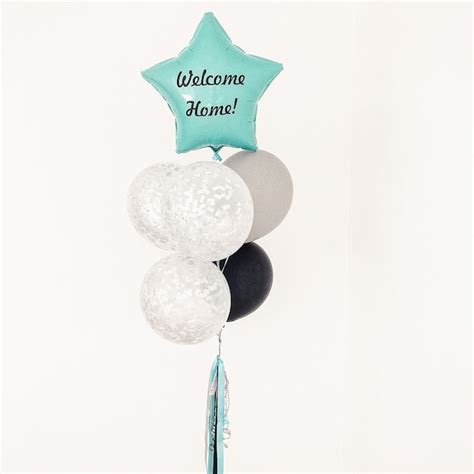 Premium Photo | A bunch of balloons with a welcome home title on a ...