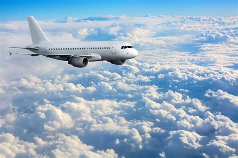 Commercial Passenger Plane Flying Above Clouds Stock Photo - Image of transport, fuselage: 71124280