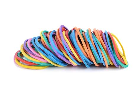 Premium Photo | Colorful rubber bands isolated on white.