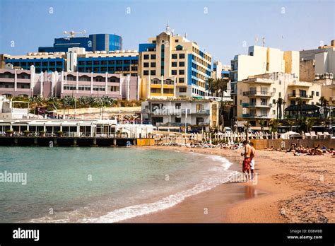 The beach at St George's Bay, Malta Stock Photo - Alamy