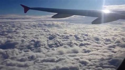 Airplane taking off & ascending above the clouds - YouTube