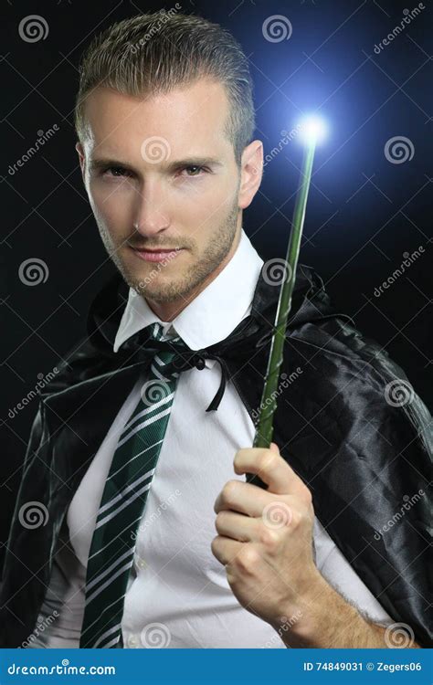 Young Wizard Holding a Magic Wand Stock Image - Image of power, wand ...