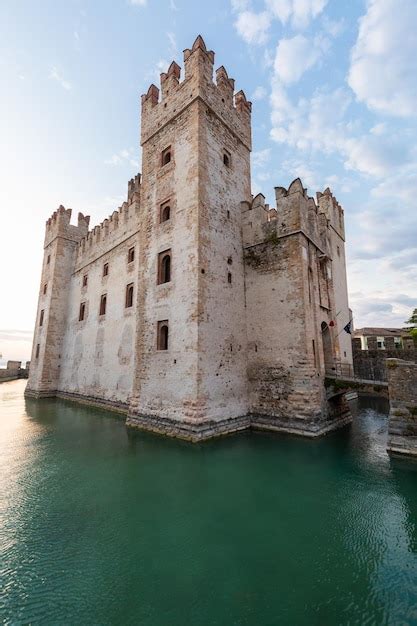 Premium Photo | Sirmione italy castle on garda lake scenic mediaeval building on the water