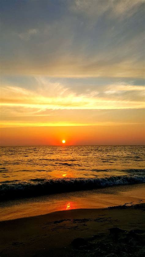 Orange and red sunset on Madiera Beach, FL | Red sunset, Sunset, Beach