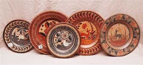 Five assorted Mexican pottery plates, (3) 12 1/4" plate