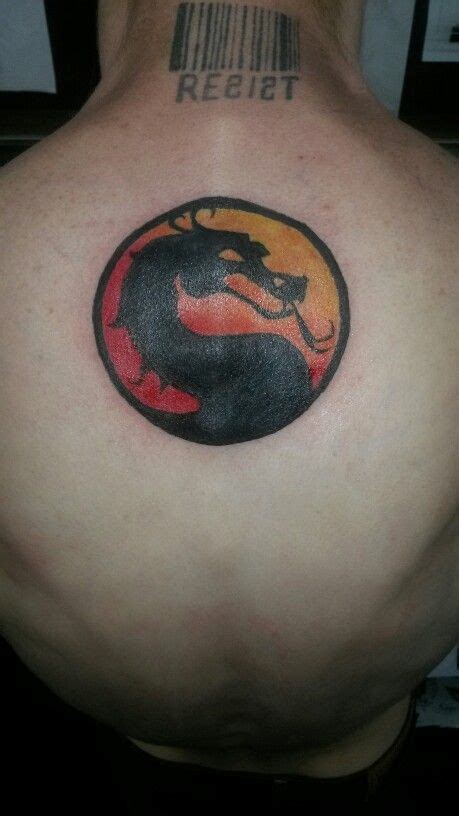 Mortal kombat logo tattoo | Mortal kombat tattoo, Ricks tattoo, Tattoo work