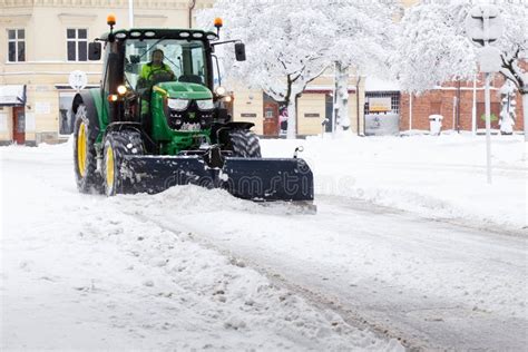 Tractor plowing snow editorial image. Image of street - 138389910