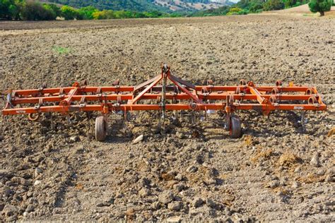 Tractor harrowing the land stock photo. Image of horizon - 31542010