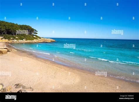 Cala de roca Plana beach in Tarragona beside Waikiki beach also Cala Fonda Stock Photo - Alamy