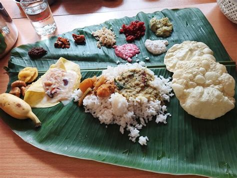 Premium Photo | Kerala onam sadhya meals in banana leaf