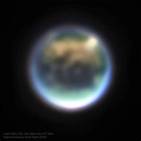 James Webb Space Telescope Captures Fuzzy Image of Saturn's Moon Titan That Looks Like Earth ...