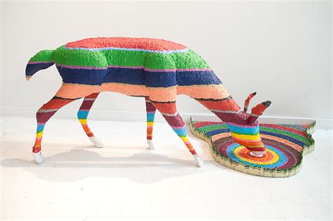 herb williams sculpts technicolor animals using thousands of crayons