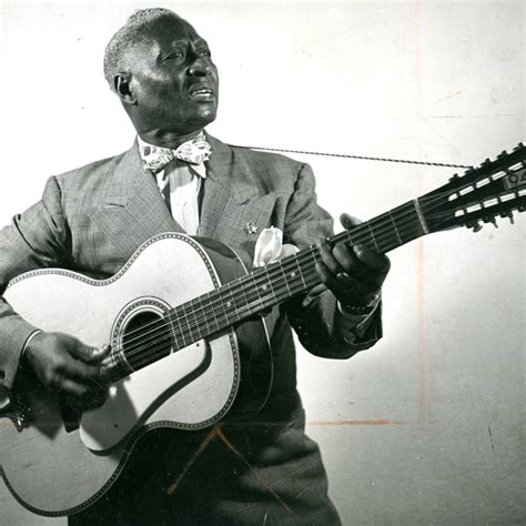 Download American Folk Blues Singer Leadbelly Black And White Portrait Wallpaper | Wallpapers.com