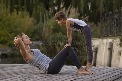 Mother and Son Exercising Yoga Pose Stock Photo - Image of hobbies, lifestyle: 131366388