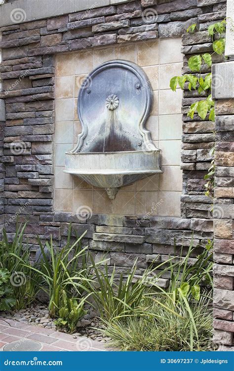 Tuscan Style Wall Water Fountain in Courtyard Stock Image - Image of italian, design: 30697237