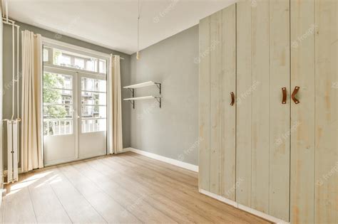 Premium Photo | Empty room with white walls and wooden floor