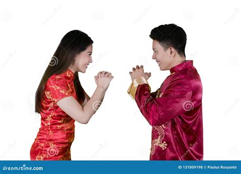 Young Couple Giving Gong Xi Fa Chai Greetings Stock Photo - Image of greeting, family: 131809198