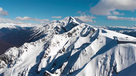 Aerial View Of Snowy Mountain Peak Stock Footage SBV-322693685 - Storyblocks