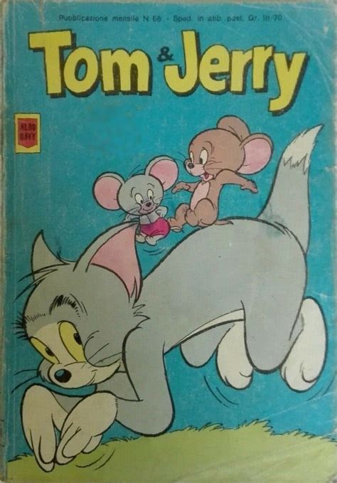 an old children's book with tom and jerry on it