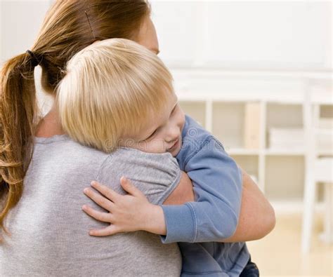 Mother Hugging And Comforting Her Son Stock Photo - Image of close, people: 6602712