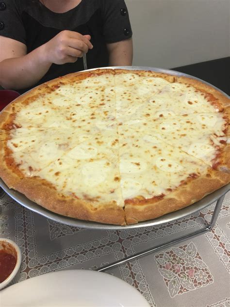 Cheese pizza with extra fresh mozzarella. Mad Hatter's Pizza, Oviedo, FL. : r/Pizza