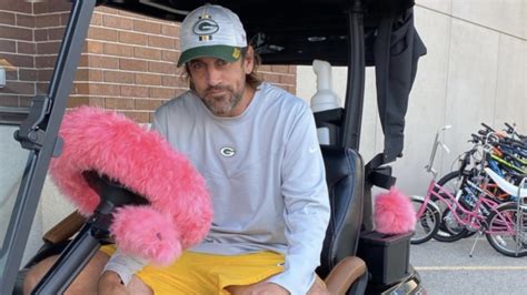 Aaron Rodgers is casually driving Green Bay in his new golf cart and we ...