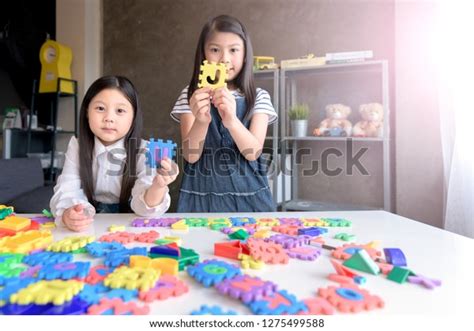 Kids Playing Alphabet Puzzle Pieces Together Stock Photo 1275499588 ...