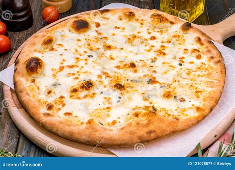 Pizza Quattro formaggi stock image. Image of tomato - 121078877