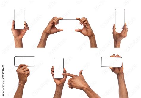 Black hands holding smart phone with blank screen isolated on white Stock Photo | Adobe Stock