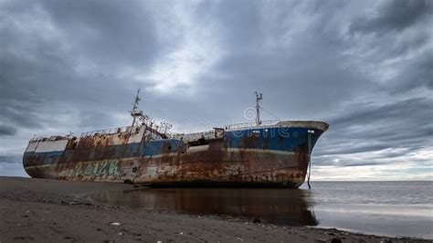 Rusty Iron Shipwreck Timelapse Stranded on Sandy Beach Stock Footage ...