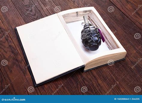 Hand Grenade Hidden in a Book Stock Photo - Image of blast, firearm: 160288664