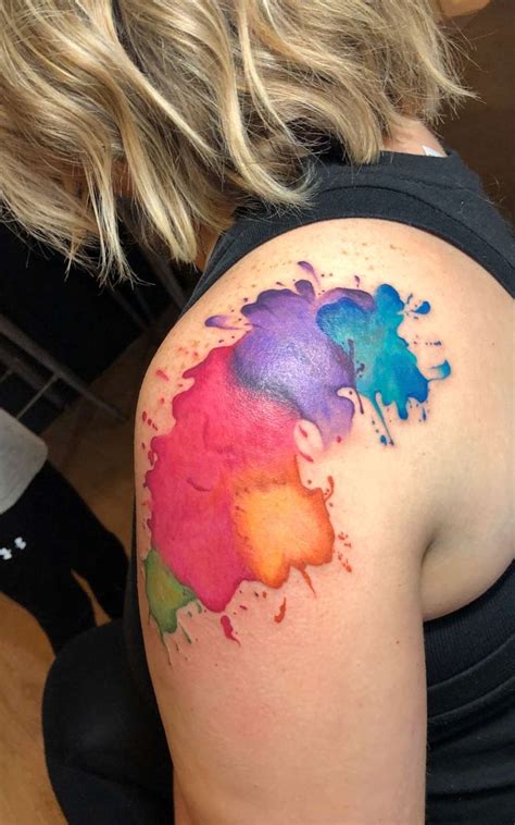 Watercolor splatter tattoo | Splatter tattoo, Arm tattoos color, Color tattoo