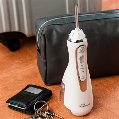 Waterpik Cordless Water Flosser Rechargeable Portable Oral irrigator for Travel & Home ...