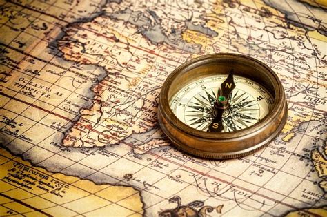 Old vintage compass on ancient map | Stock image | Colourbox