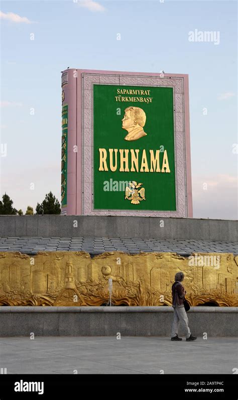 Tourist walking past the Ruhnama monument in Ashgabat Stock Photo - Alamy