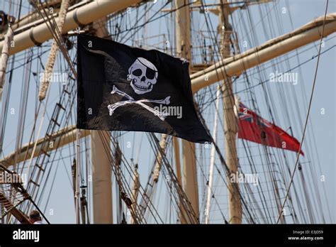 Jolly Roger pirate flag flying on tall ship at Harry Paye Day, Poole’s ...