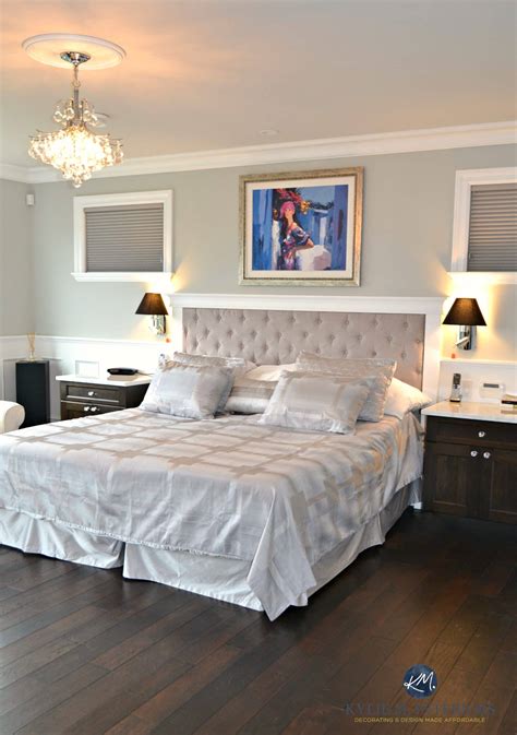 Benjamin Moore Revere Pewter in glam master bedroom with white wainscoting and crystal teardrop ...