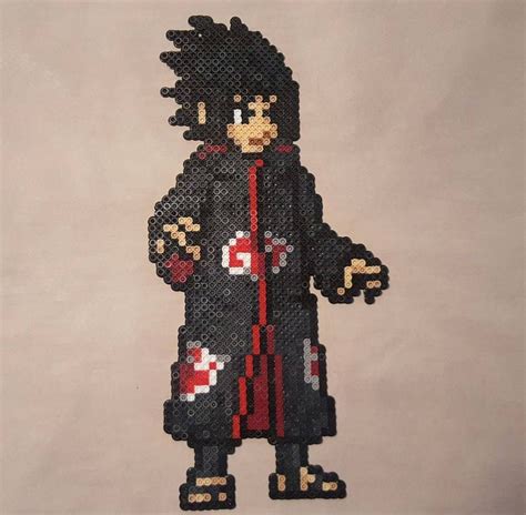 peckaponA bead sprite of Sasuke wearing the Akatsuki robe. | Pixel art characters, Perler beads ...