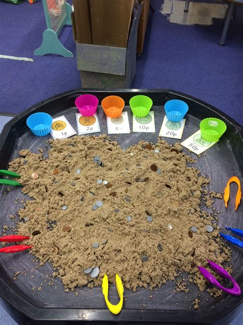 Sorting coins in the sand using tweezers. Maths Eyfs, Numeracy ...