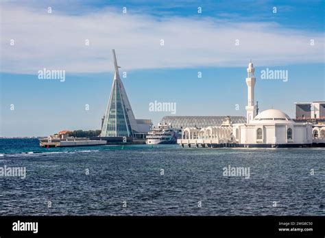 Alrahmah floating mosque with modern building and port and sea in foreground, Jeddah, Saudi ...